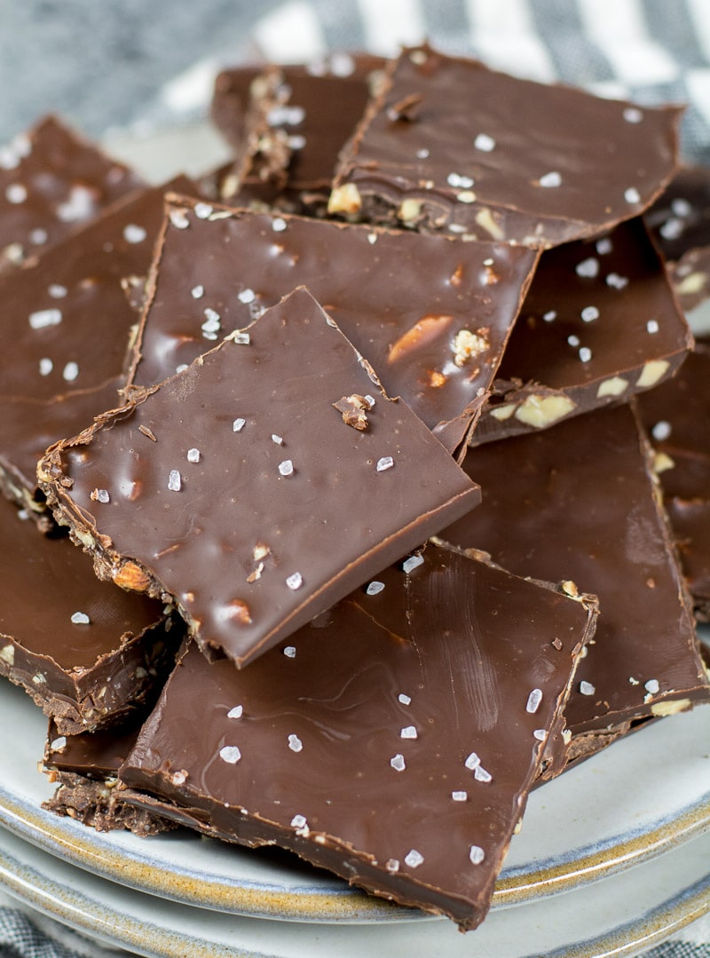 close up of a pile of keto chocolate bark on a white plate 