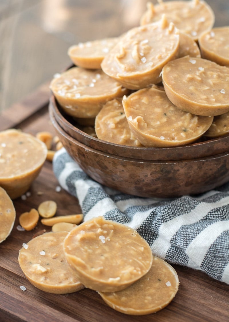 peanut butter healthy no bake cookies in a wooden bowl on a tea towel 