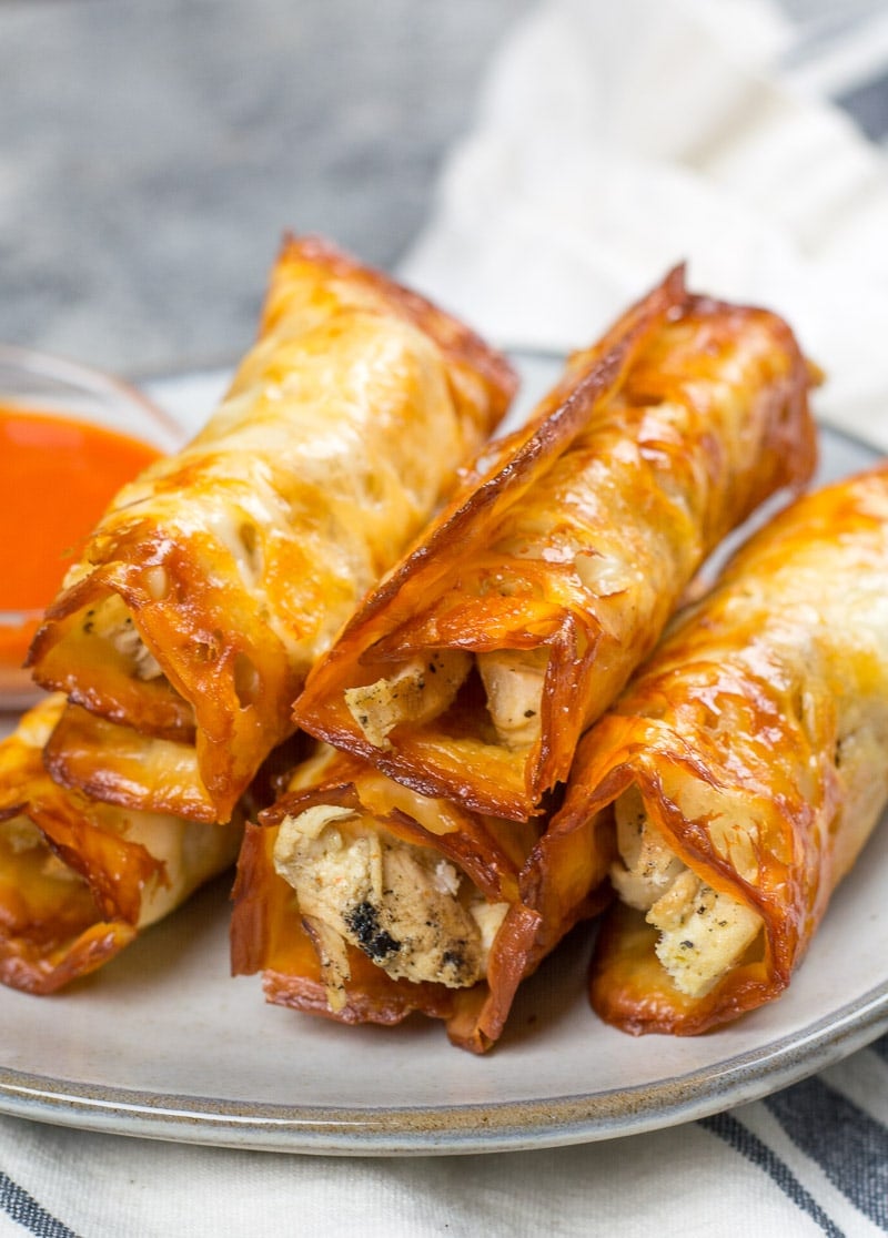 A stack of keto chicken taquitos on a plate. 