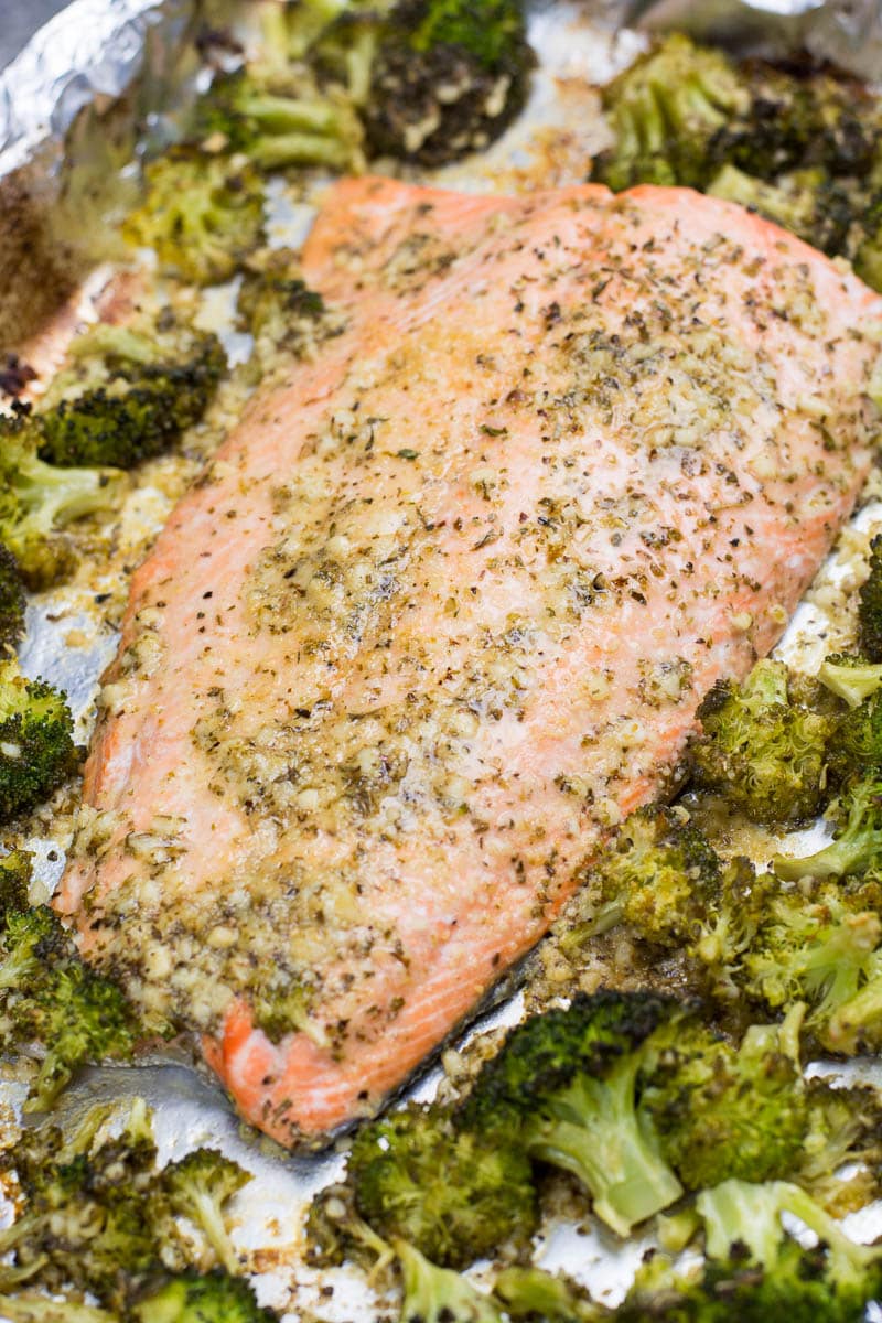 This easy Keto Garlic Butter Salmon and Broccoli Sheet Pan Dinner  is ready in 20 minutes. Packed with heart healthy fat and flavor this dish only has 5 net carbs per serving!