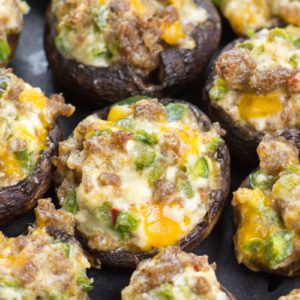 These easy Keto Jalapeno Popper Stuffed Mushrooms are loaded with sausage, peppers and cheese! This is the perfect low carb keto dinner or appetizer at only 5 net carbs per serving!