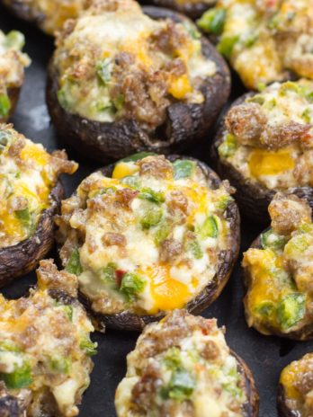 These easy Keto Jalapeno Popper Stuffed Mushrooms are loaded with sausage, peppers and cheese! This is the perfect low carb keto dinner or appetizer at only 5 net carbs per serving!