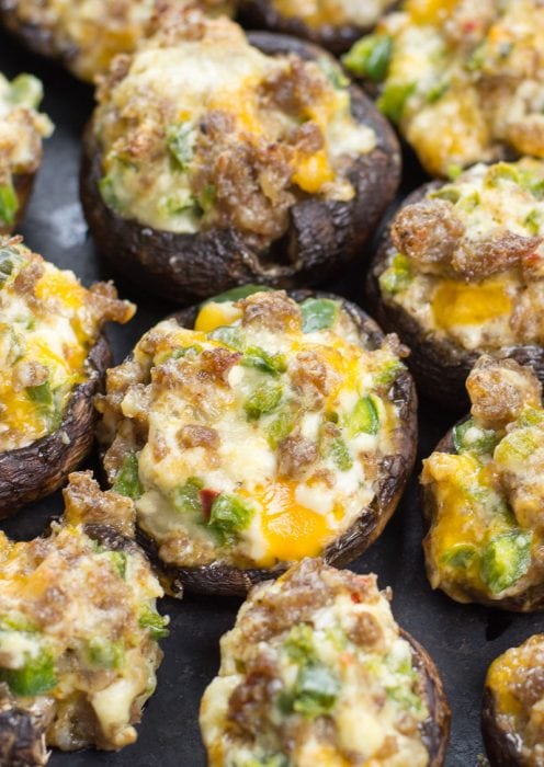 These easy Keto Jalapeno Popper Stuffed Mushrooms are loaded with sausage, peppers and cheese! This is the perfect low carb keto dinner or appetizer at only 5 net carbs per serving!