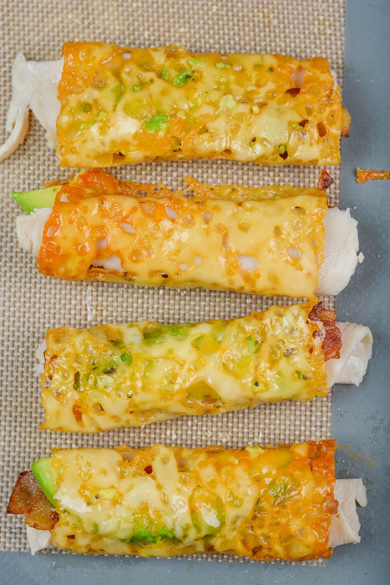 overhead view of four Oven Baked Taquitos with Turkey, Bacon, and Avocado