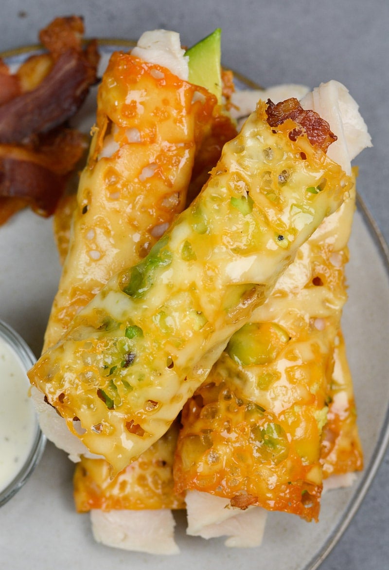 overhead view of a pile of baked keto taquitos 