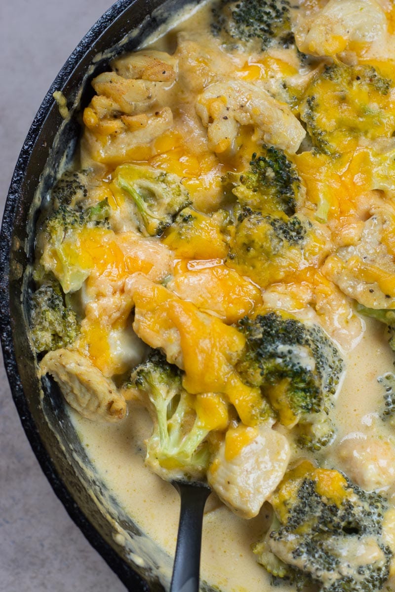 Overhead view of low carb broccoli cheddar chicken casserole in a skillet. 