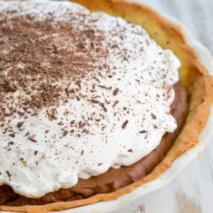 Try this Keto French Silk Pie for a decadent low carb dessert! At about 5 net carbs per slice this rich chocolate pie is an instant keto classic!