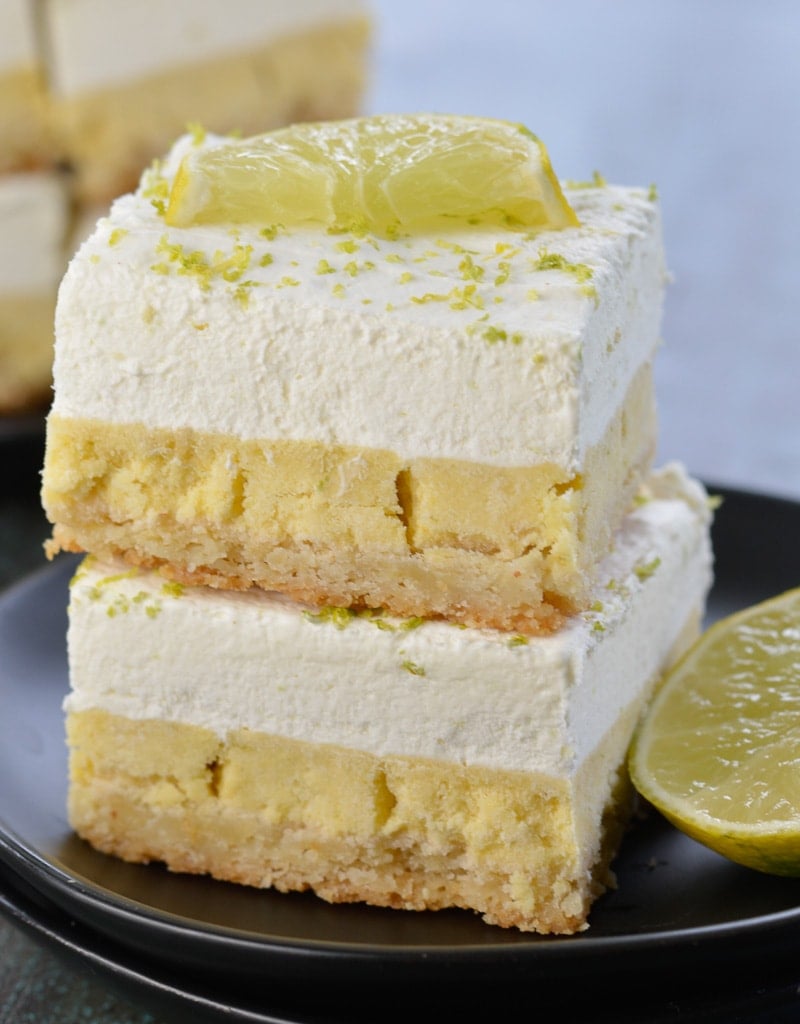 These delightful Keto Key Lime Bars feature a shortbread cookie crust, tangy lime bar layer topped with creamy lime whipped cream! At about 3 net carbs per bar this is a sweet treat that fits within your keto diet!