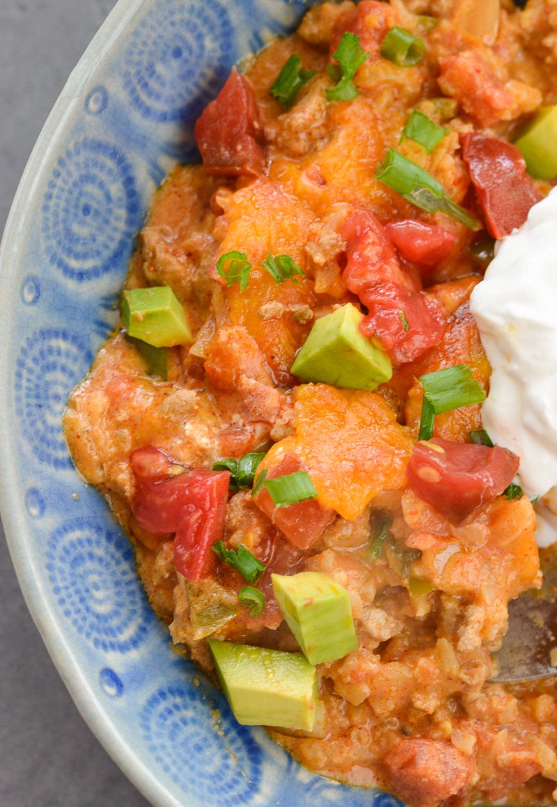 This Easy Keto Taco Skillet is packed with taco meat, cauliflower rice, vegetables and cheese. This is perfect for keto lunch meal prep or a quick and easy dinner around 6 net carbs per serving!
