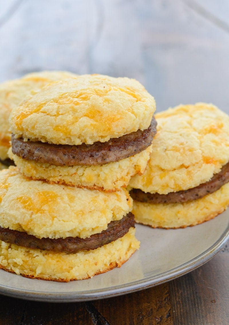 Try this Keto Sausage and Biscuit Recipe for an easy low carb breakfast! These Keto Almond Flour Biscuits are stuffed with cooked sausage patties for a high protein low carb breakfast!