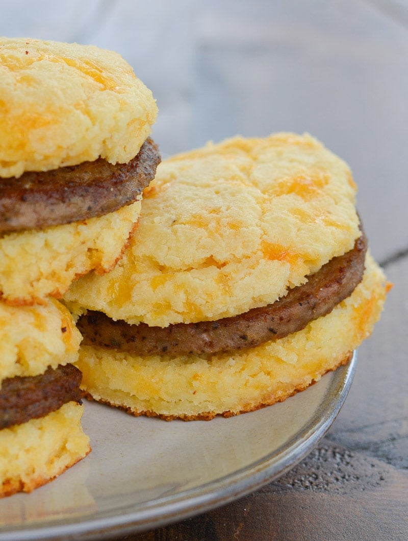 closeup shot of cheesy keto biscuits stuffed with sausage patties