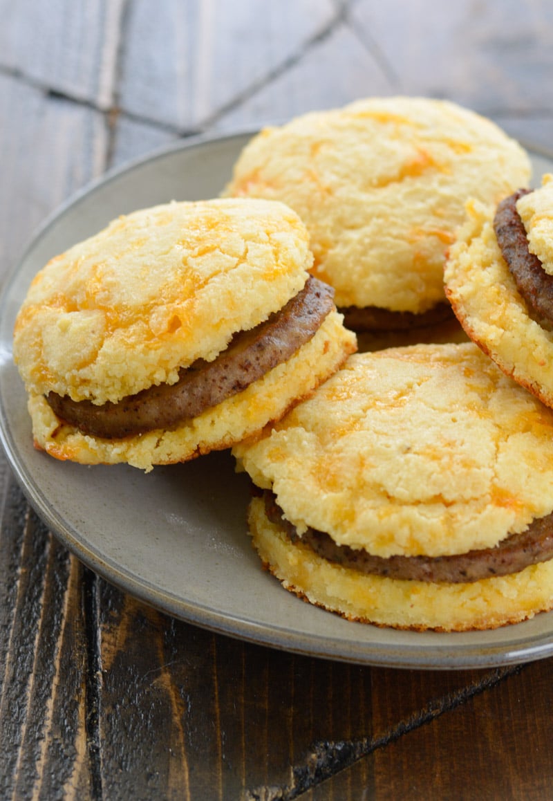 Try this Keto Sausage and Biscuit Recipe for an easy low carb breakfast! These Keto Almond Flour Biscuits are stuffed with cooked sausage patties for a high protein low carb breakfast!