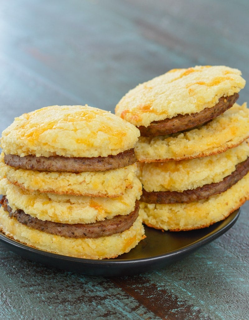 four keto sausage and biscuits stacked on a plate