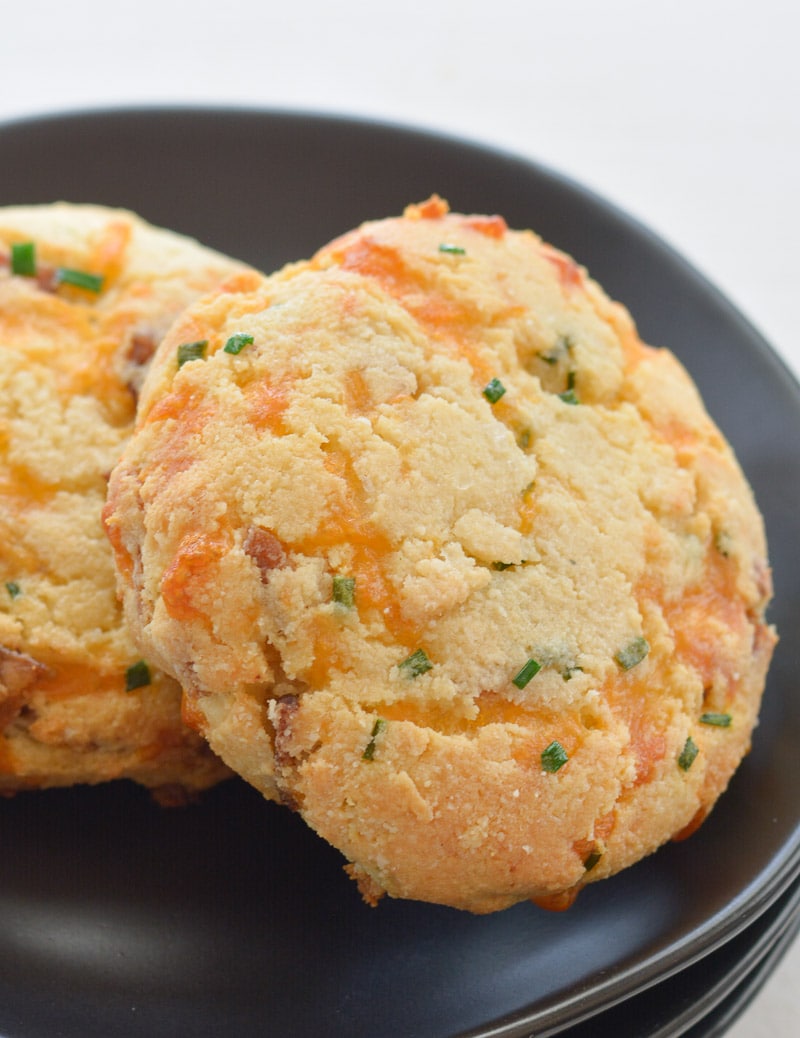 These almond flour Keto Bacon Cheddar Chive Biscuits are exploding with flavor! Packed with sharp cheddar cheese, crispy bacon and fresh chives these biscuits are the perfect low carb side with just 4 net carbs each!