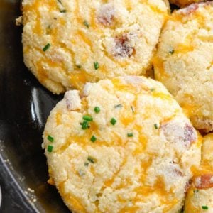 These almond flour Keto Bacon Cheddar Chive Biscuits are exploding with flavor! Packed with sharp cheddar cheese, crispy bacon and fresh chives these biscuits are the perfect low carb side with just 4 net carbs each!