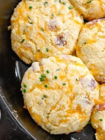 These almond flour Keto Bacon Cheddar Chive Biscuits are exploding with flavor! Packed with sharp cheddar cheese, crispy bacon and fresh chives these biscuits are the perfect low carb side with just 4 net carbs each!