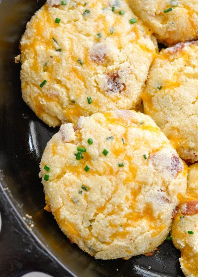 These almond flour Keto Bacon Cheddar Chive Biscuits are exploding with flavor! Packed with sharp cheddar cheese, crispy bacon and fresh chives these biscuits are the perfect low carb side with just 4 net carbs each!