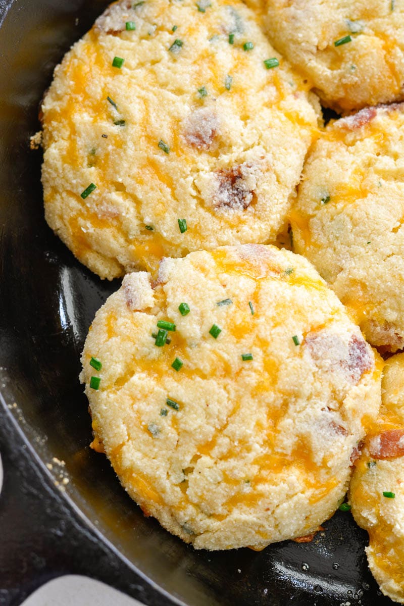 These almond flour Keto Bacon Cheddar Chive Biscuits are exploding with flavor! Packed with sharp cheddar cheese, crispy bacon and fresh chives these biscuits are the perfect low carb side with just 4 net carbs each!