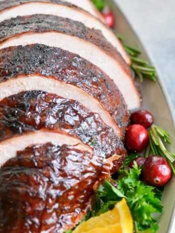 This Smoked Whole Turkey recipe is stuffed and coated in a homemade spice rub, then slow smoked to tender and juicy perfection.