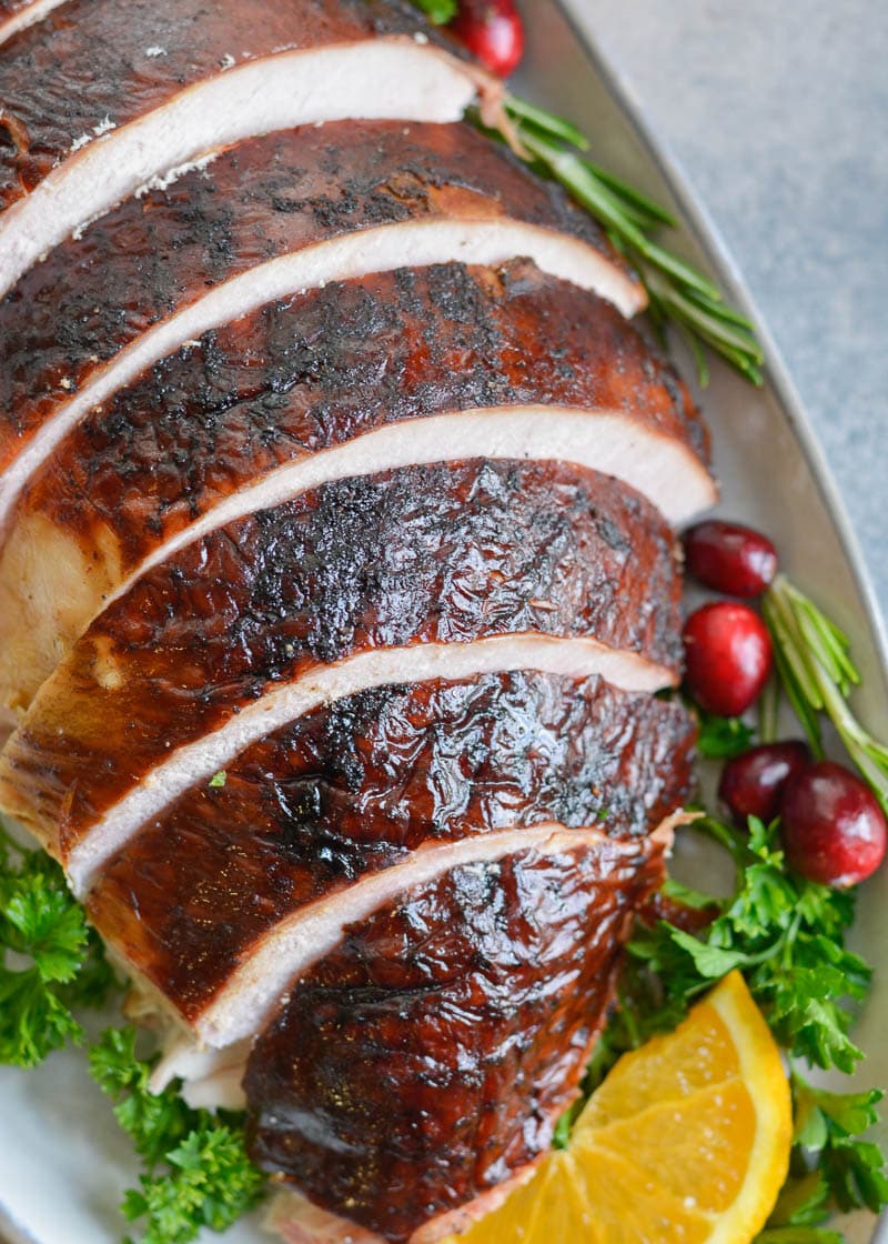 This Smoked Whole Turkey recipe is stuffed and coated in a homemade spice rub, then slow smoked to tender and juicy perfection.