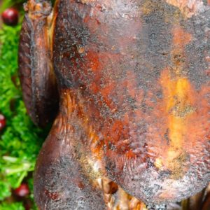 This Smoked Whole Turkey recipe is stuffed and coated in a homemade spice rub, then slow smoked to tender and juicy perfection.