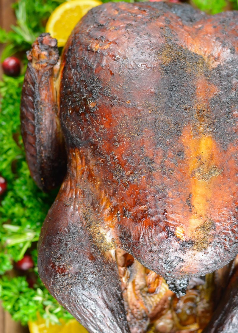 This Smoked Whole Turkey recipe is stuffed and coated in a homemade spice rub, then slow smoked to tender and juicy perfection.