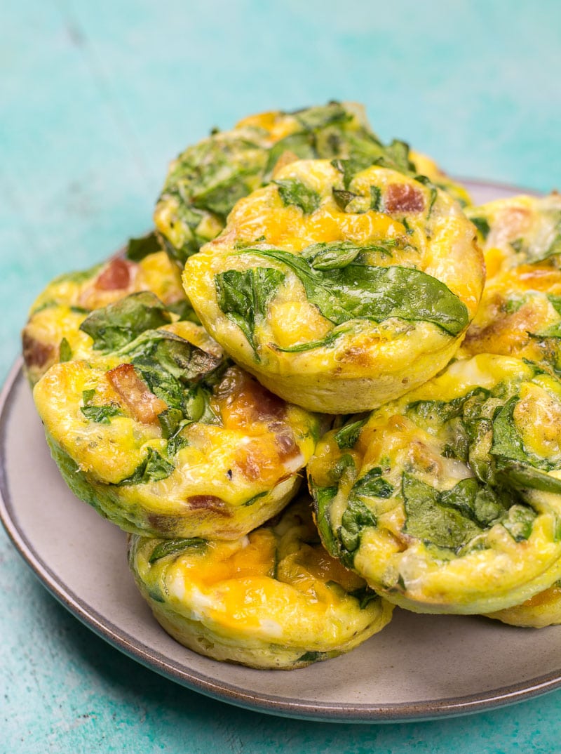 These Keto Spinach and Bacon Egg Muffins are loaded with fresh spinach, sharp cheddar and salty bacon! These low carb egg muffins are less than one net carb and perfect for keto meal prep!