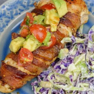 Enjoy Bacon Wrapped Chicken with Avocado Salsa for an easy weeknight meal! This low carb dish contains just 3 net carbs per serving and is ready in under 30 minutes!
