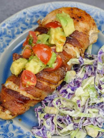 Enjoy Bacon Wrapped Chicken with Avocado Salsa for an easy weeknight meal! This low carb dish contains just 3 net carbs per serving and is ready in under 30 minutes!