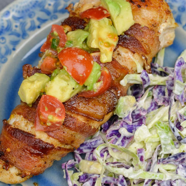 Enjoy Bacon Wrapped Chicken with Avocado Salsa for an easy weeknight meal! This low carb dish contains just 3 net carbs per serving and is ready in under 30 minutes!