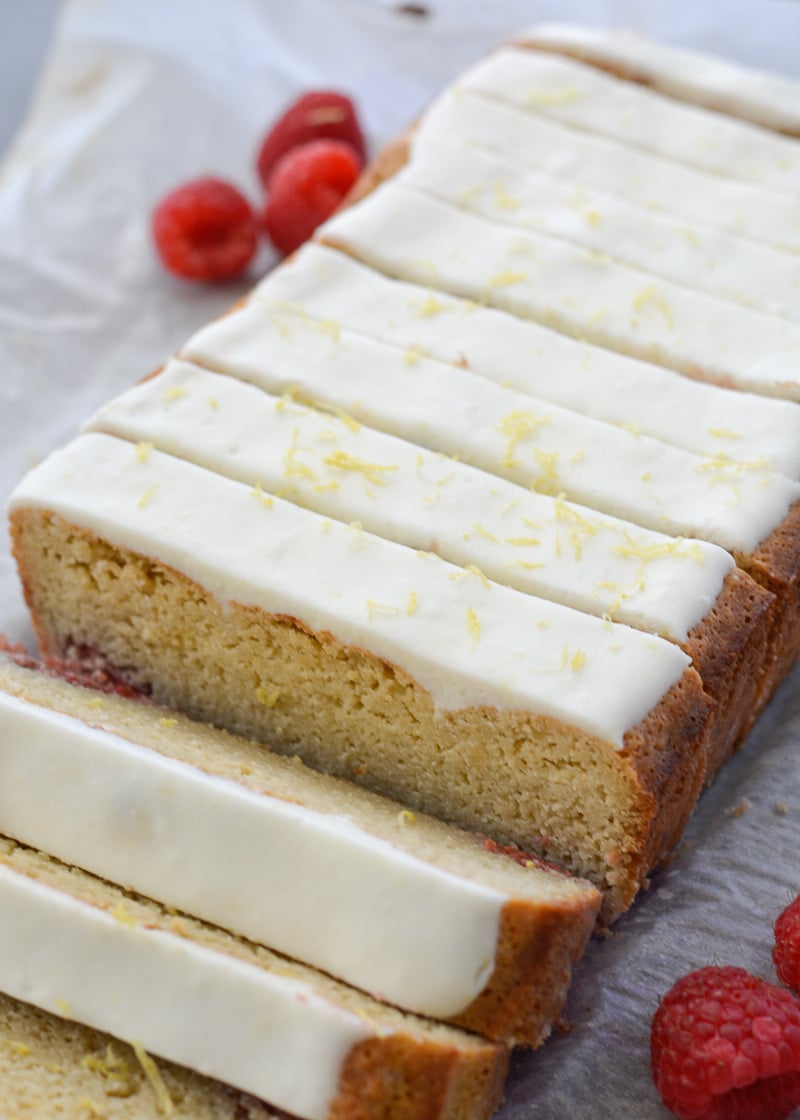 Enjoy a slice of Keto Lemon Raspberry Bread topped with Lemon Cream Cheese Glaze for under 3 net carbs per slice!