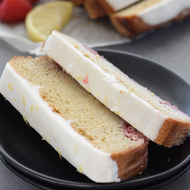 Enjoy a slice of Keto Lemon Raspberry Bread topped with Lemon Cream Cheese Glaze for under 3 net carbs per slice!
