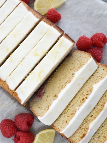 Enjoy a slice of Keto Lemon Raspberry Bread topped with Lemon Cream Cheese Glaze for under 3 net carbs per slice!