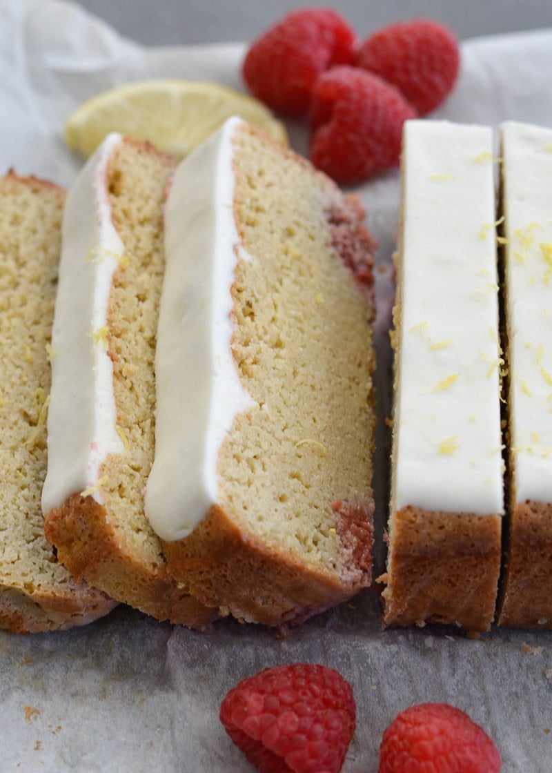 Enjoy a slice of Keto Lemon Raspberry Bread topped with Lemon Cream Cheese Glaze for under 3 net carbs per slice!