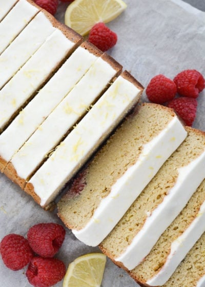 Enjoy a slice of Keto Lemon Raspberry Bread topped with Lemon Cream Cheese Glaze for under 3 net carbs per slice!