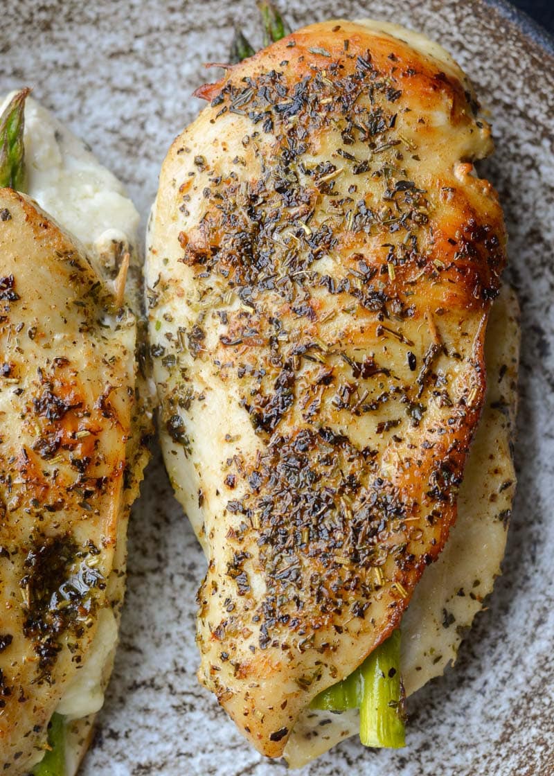 This Asparagus Stuffed Chicken is loaded with two kinds of cheese, tender asparagus and is rubbed with an Italian herb mix. This one pan, low carb recipe has about 2 net carbs per serving and is ready in 30 minutes. 