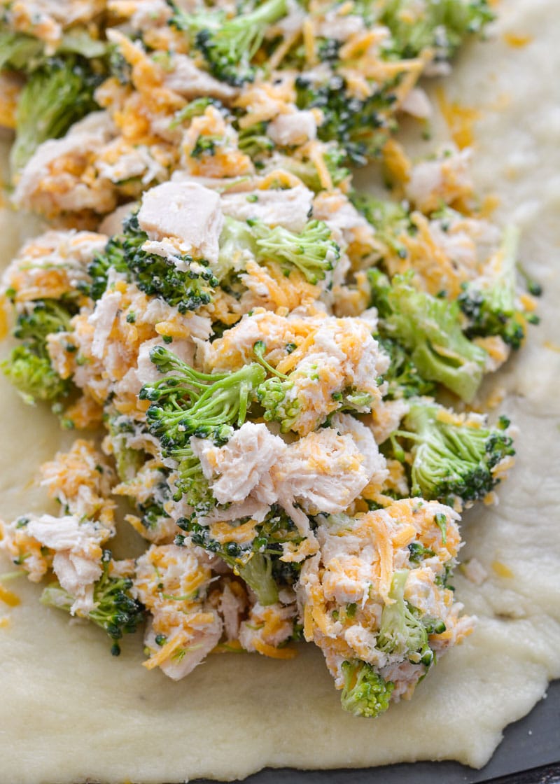 This Chicken Broccoli Cheddar Hot Pocket is loaded with tender chicken, fresh broccoli and loads of cheese wrapped in a perfectly soft and fluffy crust! Each slice is about 3 net carbs!