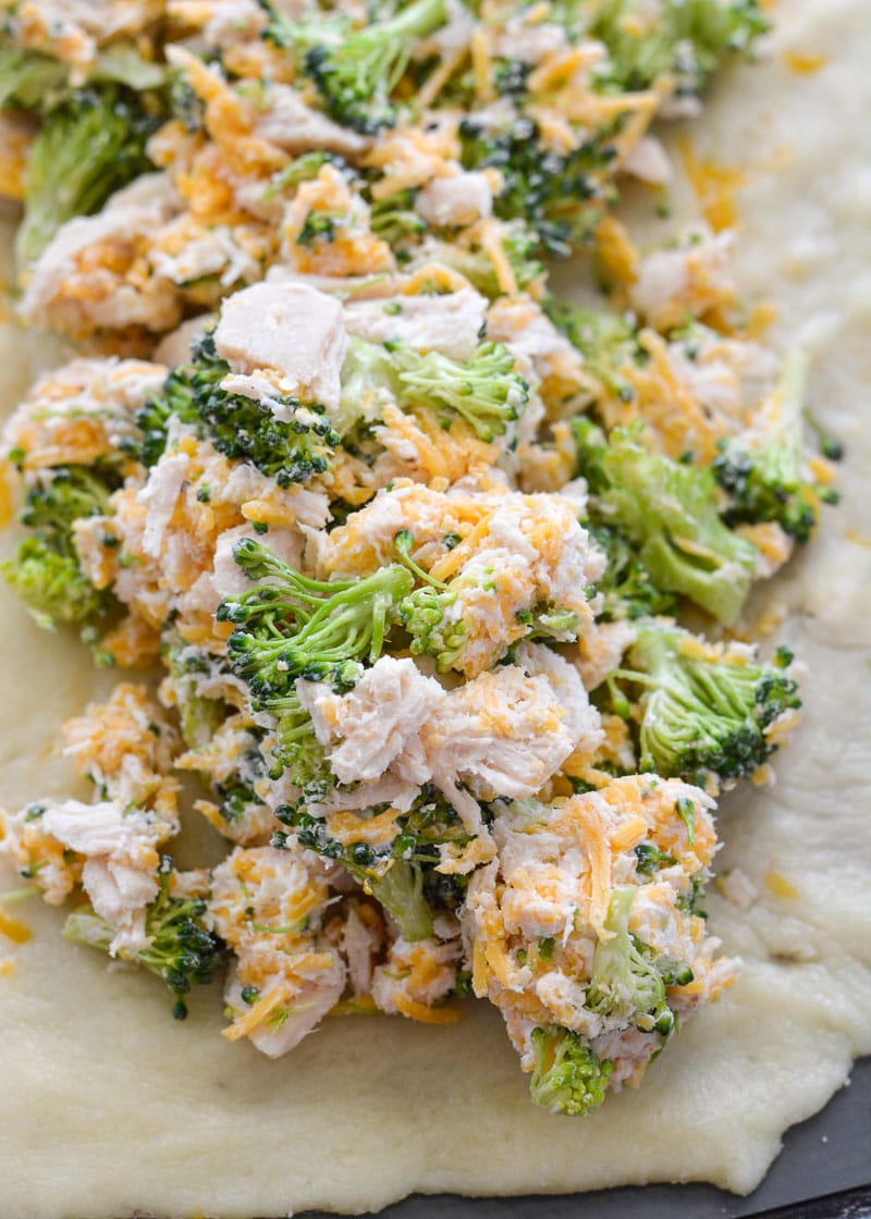 This Chicken Broccoli Cheddar Hot Pocket is loaded with tender chicken, fresh broccoli and loads of cheese wrapped in a perfectly soft and fluffy crust! Each slice is about 3 net carbs! 