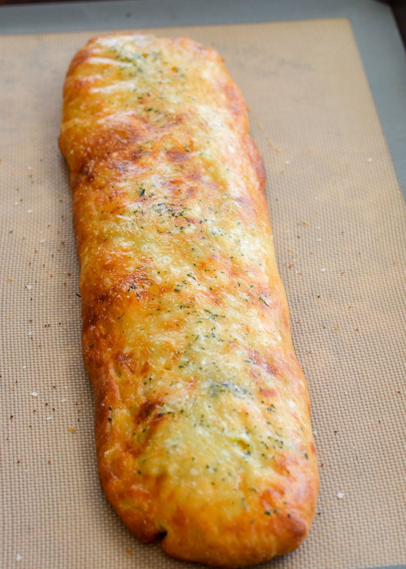 This Chicken Broccoli Cheddar Hot Pocket is loaded with tender chicken, fresh broccoli and loads of cheese wrapped in a perfectly soft and fluffy crust! Each slice is about 3 net carbs! 