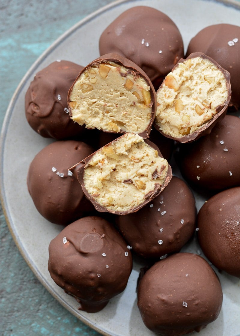 These Keto Peanut Butter Cheesecake Truffles require just 6 ingredients and no baking! These low carb delights are about 2.5 net carbs each and perfect for satisfying your sweet tooth! 