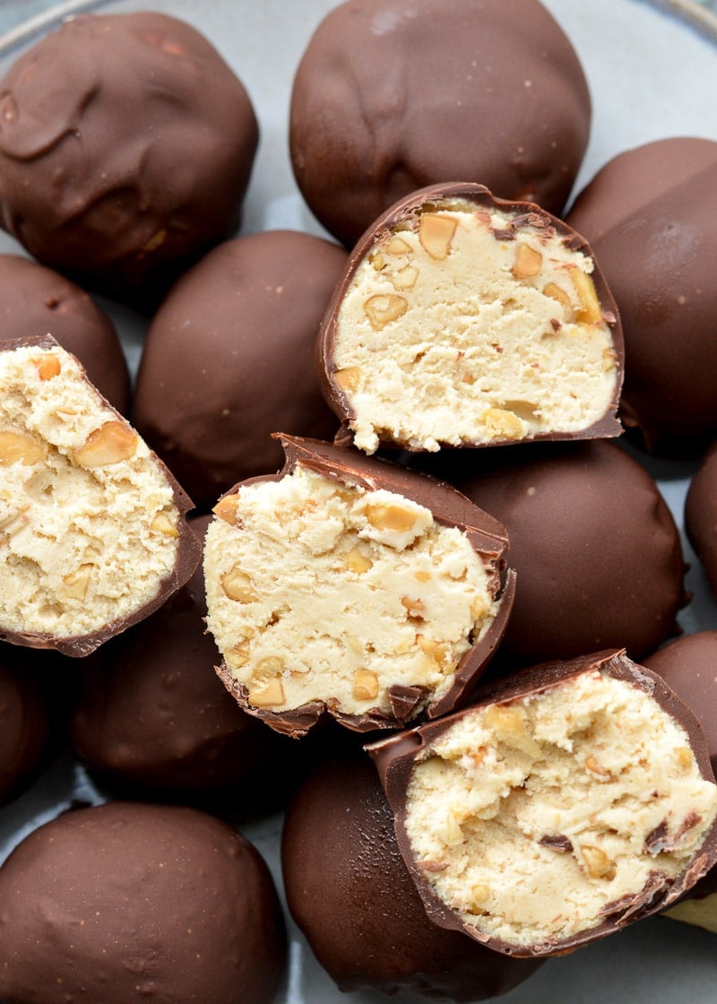 These Keto Peanut Butter Cheesecake Truffles require just 6 ingredients and no baking! These low carb delights are about 2.5 net carbs each and perfect for satisfying your sweet tooth!