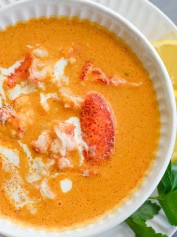 This creamy Lobster Bisque is a shortcut recipe that is low on carbs, but big on flavor! This 30 minute soup recipe features a savory broth and garlic butter lobster for a truly decadent meal! 