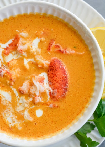 This creamy Lobster Bisque is a shortcut recipe that is low on carbs, but big on flavor! This 30 minute soup recipe features a savory broth and garlic butter lobster for a truly decadent meal! 