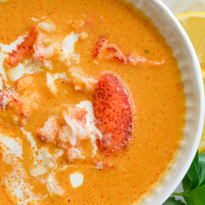 This creamy Lobster Bisque is a shortcut recipe that is low on carbs, but big on flavor! This 30 minute soup recipe features a savory broth and garlic butter lobster for a truly decadent meal! 