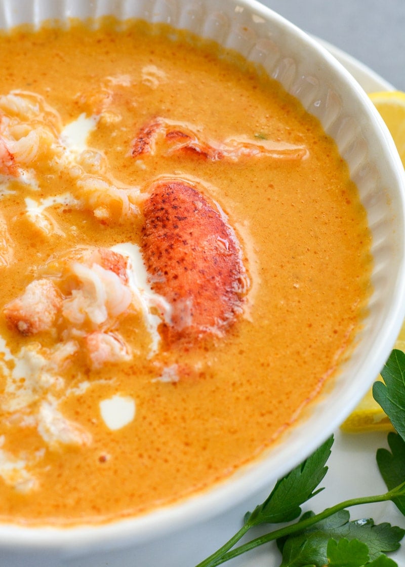 This creamy Lobster Bisque is a shortcut recipe that is low on carbs, but big on flavor! This 30 minute soup recipe features a savory broth and garlic butter lobster for a truly decadent meal! 