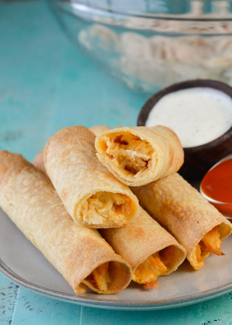 These 6-ingredient Buffalo Chicken Taquitos make an excellent, super-filling snack or dinner! Start with cooked, shredded chicken to have them ready in 30 minutes!