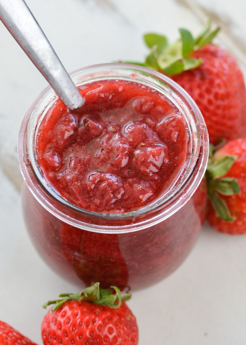  This Keto Cheesecake with Strawberry Sauce is the perfect low-carb treat to enjoy fresh berries this summer! 