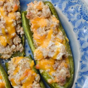 Keto Sausage Stuffed Jalapeno Poppers are the ultimate low carb appetizer! Each generous serving size has less than 3 net carbs!