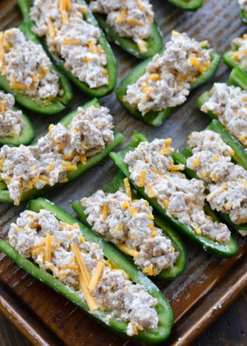 Keto Sausage Stuffed Jalapeno Poppers are the ultimate low carb appetizer! Each generous serving size has less than 3 net carbs!