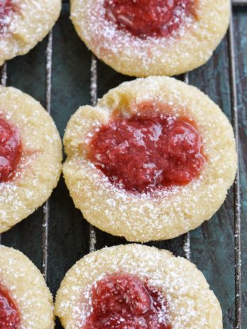 Keto Strawberry Thumbprint Cookies are the perfect sweet treat for about 2 net carbs each! Low carb sugar cookies are packed with fresh strawberry sauce and baked until soft and chewy! 